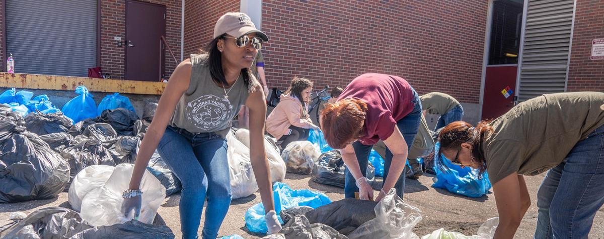 people pickup bags of trash